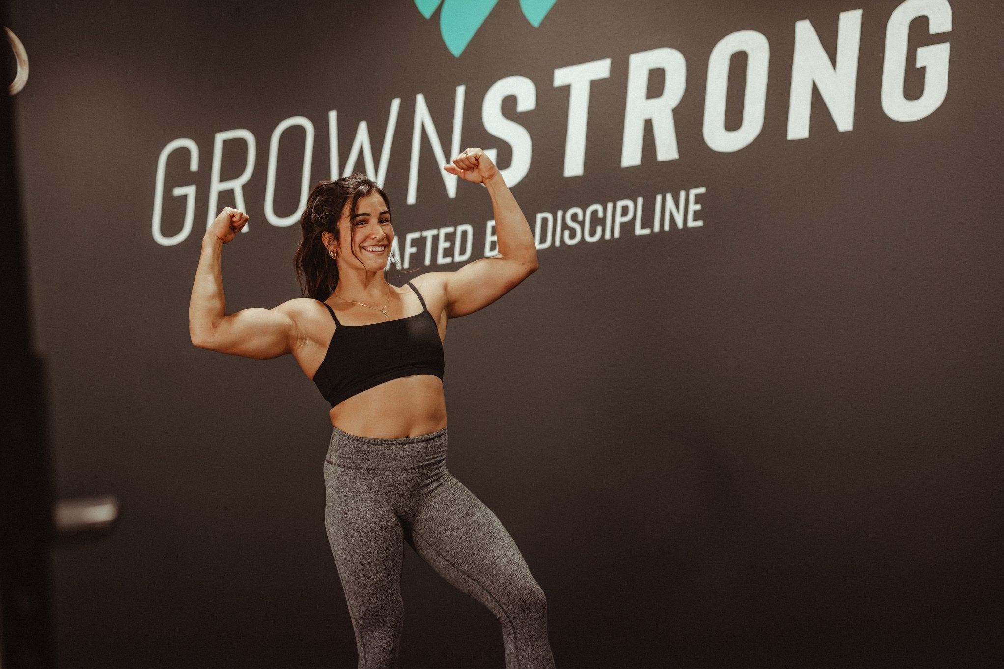 Woman performing a strength training exercise as part of a Grown Strong fitness program